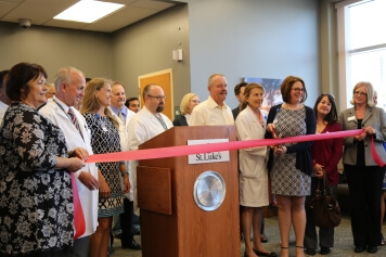 St. Luke’s Director of Surgical Services Toni Schultz cuts the ribbon celebrating the new Surgical & Procedural Care expansion
